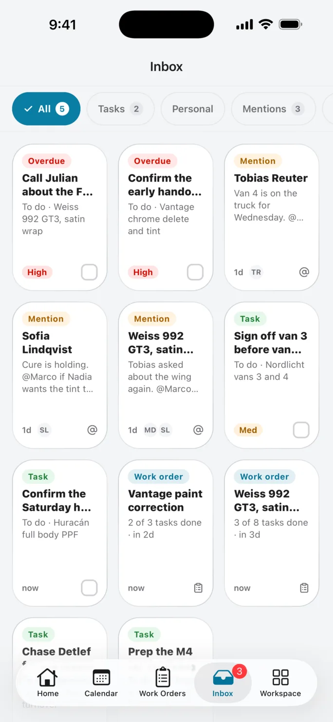 The Slate inbox on iPhone, with All, Tasks, Personal and Mentions filters above cards for overdue tasks, teammate mentions and work-order progress.