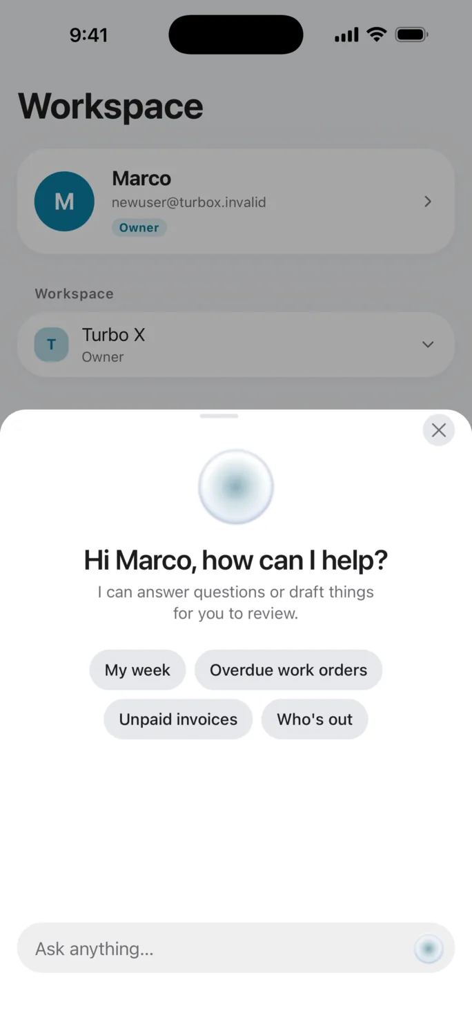 Slate Iris open over the workspace screen on iPhone, greeting the owner by name and offering four things to ask about: their week, overdue work orders, unpaid invoices and who is out.